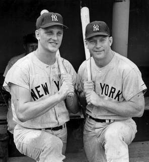 Picture Roger Maris and Mickey Mantle hold bats.